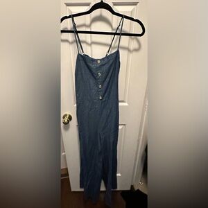 Derek hearts jumpsuit. Soft denim material. Open back with tie. Wide pant leg.